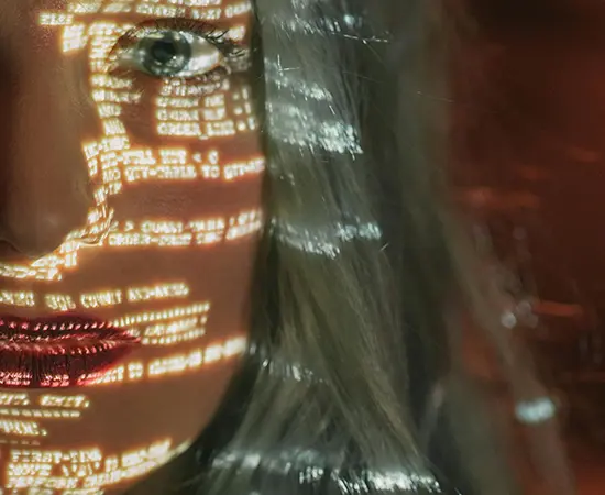 AI warning - reflection of code on a persons face